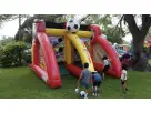 Soccer Fever dual-slide bounce house rental in Austin with interactive goals, perfect for Kyle birthday parties and competitive