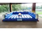 Perfect for Cedar Park summer parties, this Big Wave mechanical surf inflatable rental in Austin features a realistic surfboard