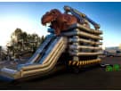 Ultimate T-Rex dinosaur bounce house rental in Houston with dual slides, ideal for Cypress birthday parties and events.