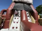 Military-themed obstacle course rental in Austin with dual climbing walls and slide, ideal for large events in Leander.