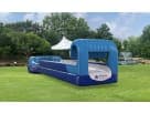 Blue inflatable obstacle course with tunnel setup at a Houston event venue, ideal for summer party rentals in Cypress.
