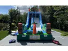 Perfect for Austin summer parties, this tropical water slide rental features dual climbing walls and an attached pool