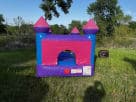 Perfect for Georgetown birthday parties, this pink and purple castle bounce house rental in Austin features indoor/outdoor