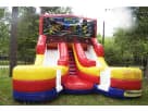 Ninja Turtles double slide water bounce house rental in Houston backyard with dual lanes, ideal for Sugar Land parties.