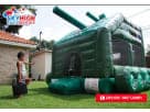 Green military tank bounce house rental in Austin holding up to 5 children, ideal for Kyle birthday parties and themed events.