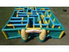 Perfect for Austin parties, this inflatable corn maze rental features flexible indoor-outdoor setup with blue and yellow tubing