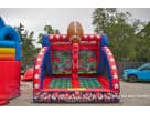 Red and blue football moonwalk rental in Houston features dual lanes and giant football topper, ideal for Katy parties.