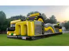 Toxic Adventure obstacle course rental with rockwall slide set up on grass in Dallas, ideal for kids' birthday parties