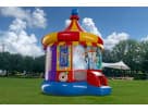 Toy Story 4 carousel bounce house rental in Houston with rotating top and slide, ideal for Spring birthday parties.