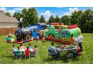 Fun Express Train Station obstacle course rental in Dallas with attached green car module, ideal for kids' parties in Fort Worth.