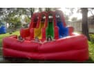 Perfect for Houston birthday parties, this 3 Lane Rainbow Wet/Dry Slide rental features three racing lanes ideal for competitive