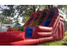 Perfect for Houston parties, this 3 Lane Rainbow Wet/Dry Slide rental features multiple racing lanes ideal for competitive summer