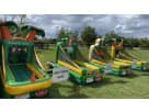 Tropical luau carnival game station rental in Dallas with basketball hoop and tee-ball stand, ideal for Hawaiian or sports themed