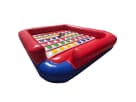 Red and blue Inflatable Twister game rental in Austin with colorful dot grid surface, ideal for interactive party entertainment