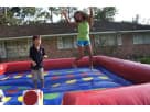 Inflatable Twister interactive game rental in Austin with colorful geometric patterns, ideal for San Marcos birthday parties