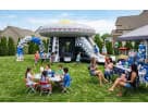 UFO Spaceship bounce house rental in Austin with slide, ideal for Pflugerville parties — holds up to 6 kids ages 3+.