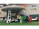 UFO Spaceship bounce house rental in Austin with slide, holds up to 6 kids, ideal for large events in Buda.