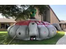 UFO Laser Tag interactive bounce house rental in Houston, gray and red inflatable with alien figure, perfect for Cypress birthday