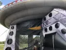 UFO Spaceship bounce house rental in Austin with slide, holds up to 6 kids—perfect for Buda birthday parties and large events.