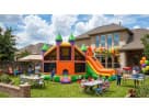 Ultimate 3-in-1 bounce house with dual slides and rock wall available for rental in Dallas, ideal for Irving birthday parties