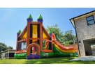 Colorful 3-in-1 bounce house with rock wall and slide available for rental in Dallas, ideal for Plano birthday parties and school