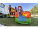 Perfect for Dallas birthday parties, this colorful 3-in-1 bounce house rental features dual slides and a rock wall ideal for kids