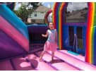 Unicorn-themed toddler water slide rental in Dallas backyard with rainbow panels, perfect for kids ages 2-11.