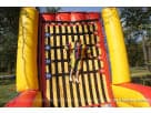 Yellow and red Velcro Wall rental in Houston with height markers, ideal for interactive party entertainment in The Woodlands.