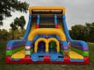 Colorful dual-lane rock wall and slide rental in Austin, perfect for all ages at outdoor parties in Leander.