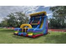 Colorful rock wall and slide combo rental set up at an Austin park, ideal for all ages with a 22ft climbing challenge