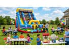 Colorful dual rock wall slide rental in Austin backyard setup, 22ft tall climbing adventure ideal for all ages.