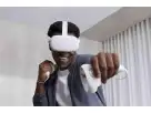Man demonstrating virtual reality headset with motion controllers, ideal for Dallas VR gaming rentals and immersive party