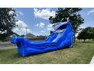 Bright blue dual-lane water slide rental brings backyard fun to Buda and Austin summer celebrations.