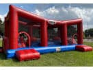 Curso de obstáculos Wipe-Out con techo de malla disponible para renta en Austin — perfecto para eventos en Buda.