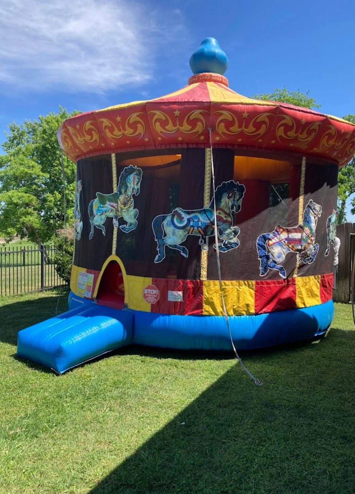 Carousel Bounce House Moonwalk setup on grass Google Customer Review