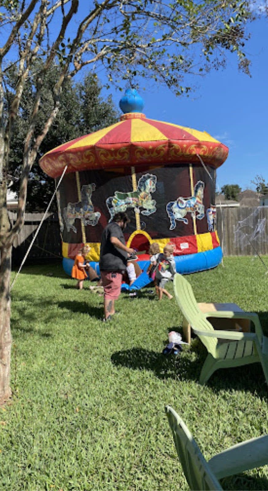 Customer Rented Carousel Bounce House in Backyard left Google Review