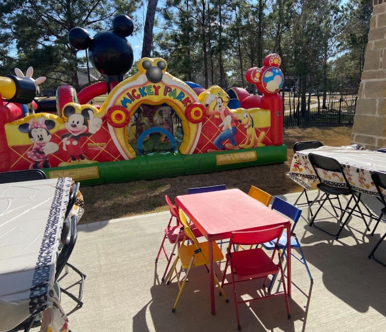 Table and Chair Rentals and Mickey Toddler Bounce House from Sky High Party Rentals